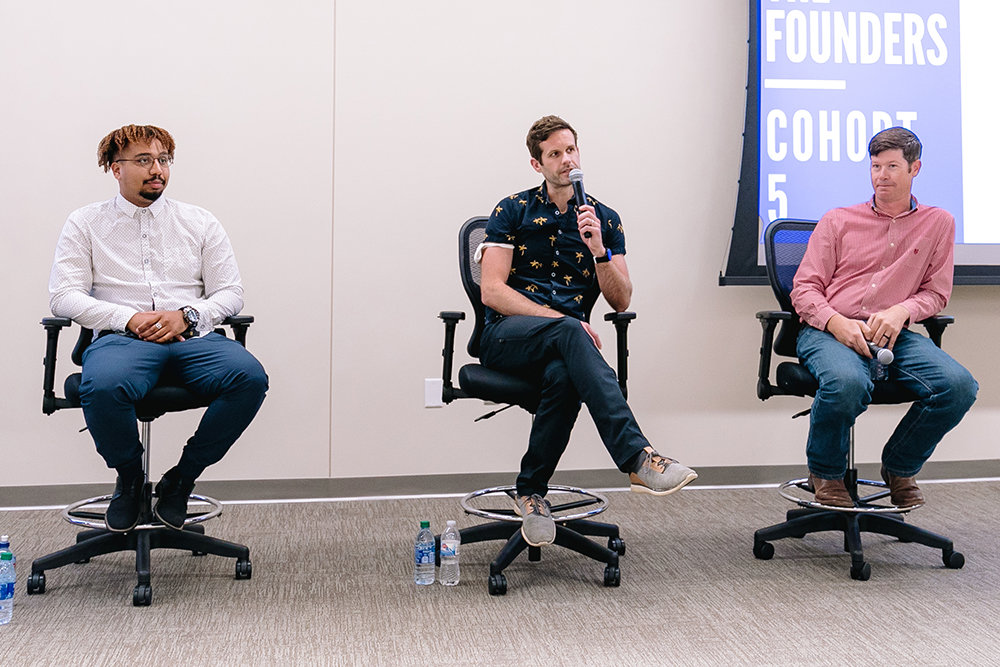 At an Aug. 3 forum introducing the Efactory's fifth business accelerator cohort, Jahbarie Jefferson, left, Nic Lamphear and Kevin Johansen discuss the origin of their startups.