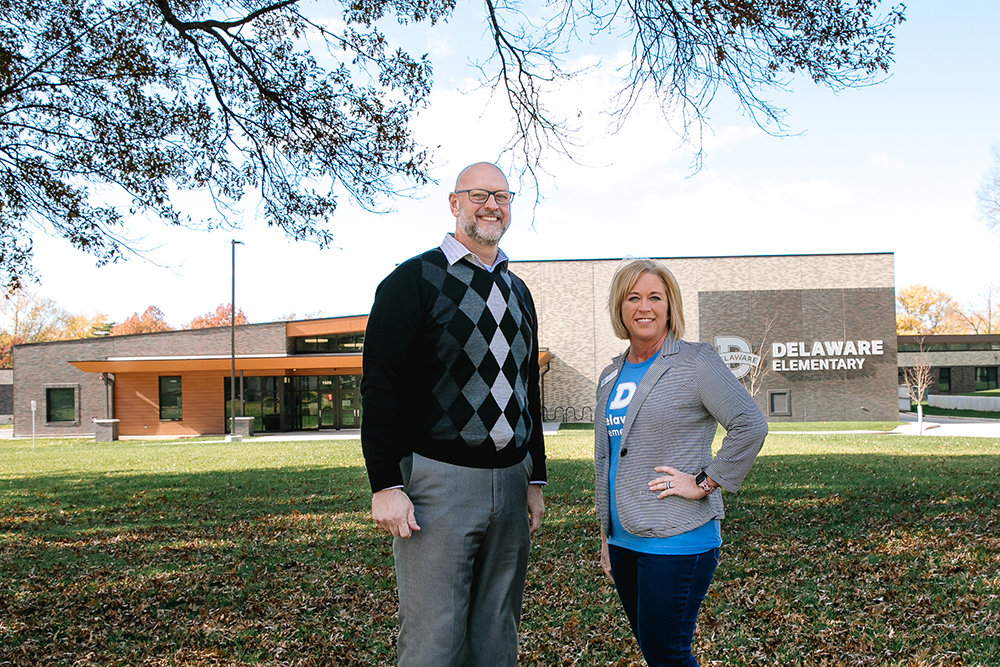 Standing in front of the new Delaware Elementary building are Travis Shaw, Springfield Public Schools' executive director of operations, and Stephanie Young, building principal.