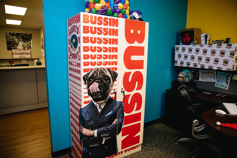 A design concept on a locker lets guests know the doughnuts are “bussin,” a word that means something is really good.