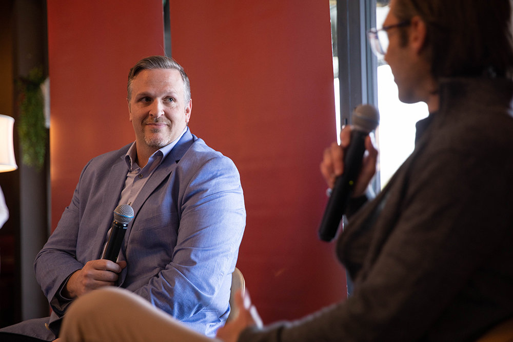 Jason Outman, left, discusses a regional approach to tourism and economic development in an interview with SBJ Editorial Vice President Eric Olson at The Backlot.