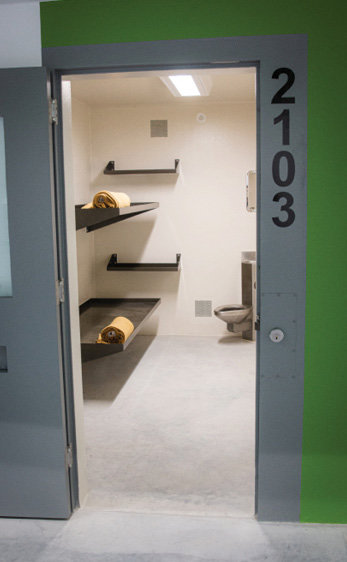 Cells are sparse, with bunks and a toilet inside. All fixtures are suicide resistant, and some cells have accessibility features.