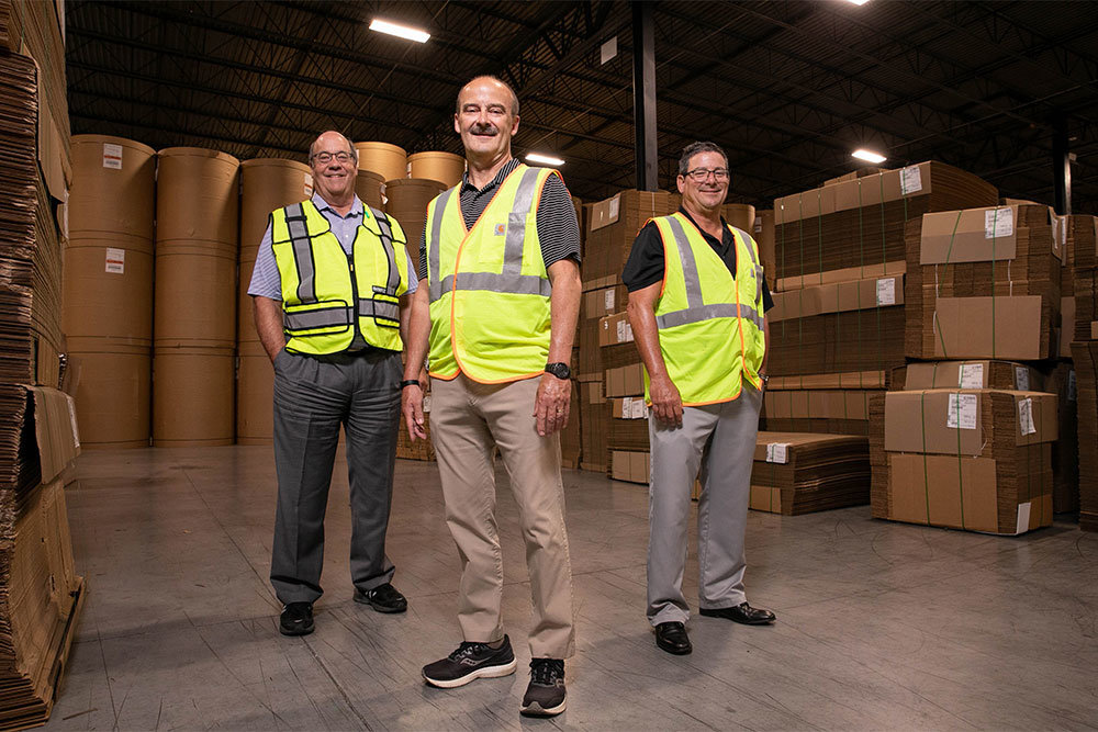 From left, Chair/CEO Kevin Ausburn, President/CEO Rich Bachus and Executive Vice President Randy Bachus lead SMC Packaging Group, started as Southern Missouri Containers by their fathers.