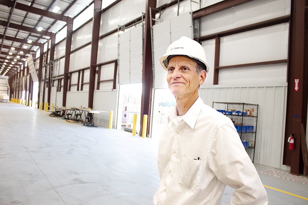 Eric Roberts stands before some of the shipping bays in the 110,000-square-foot building he leased to Lippert Components.