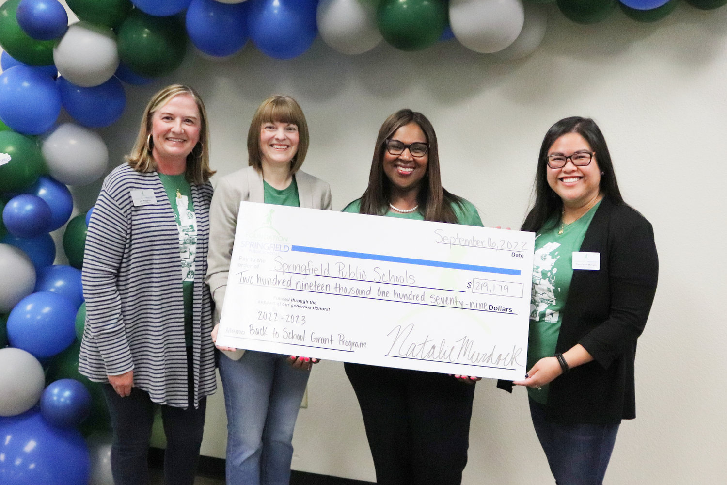 SPS Superintendent Grenita Lathan, second from right, accepts grants on behalf of the district from Foundation for SPS officials Jill Wiggins, Natalie Murdock and Tina Pham-Morgan.