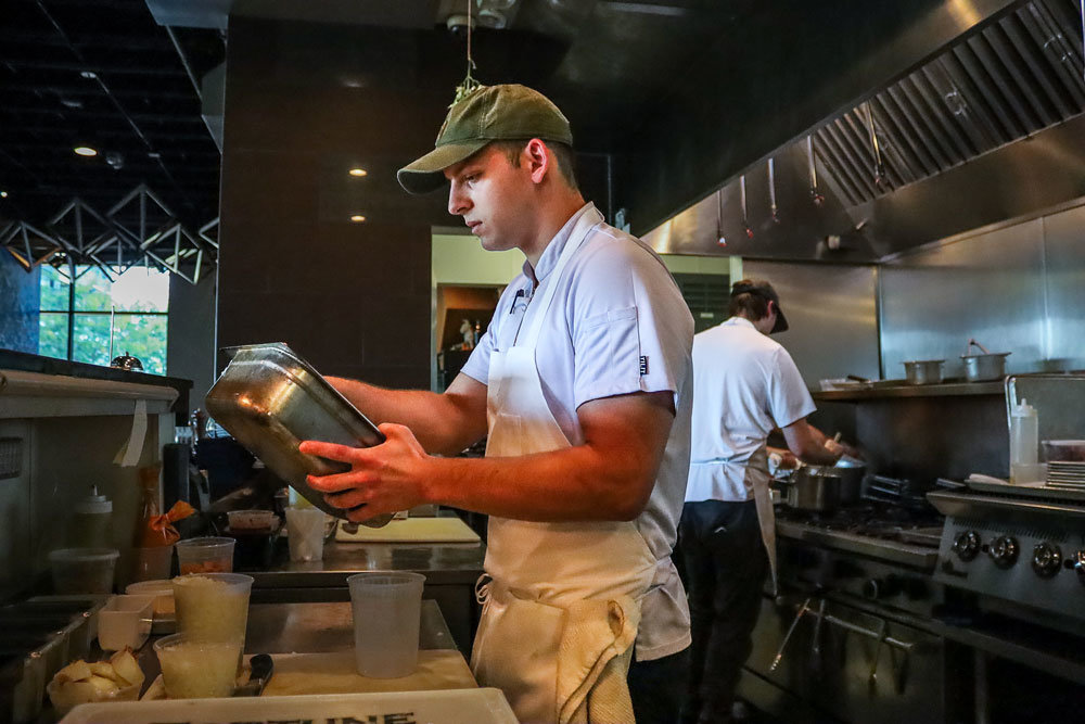 Connor Shaw, a summer 2022 graduate of Ozarks Technical Community College's culinary arts program, works in the kitchen at Progress, a restaurant in Farmers Park.