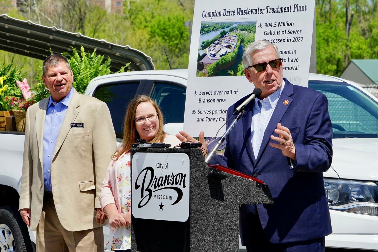 Gov. Mike Parson, from right, Missouri Department of Economic Development Acting Director Maggie Kost and Branson Mayor Larry Milton participate in a ceremony at the treatment plant on April 14.