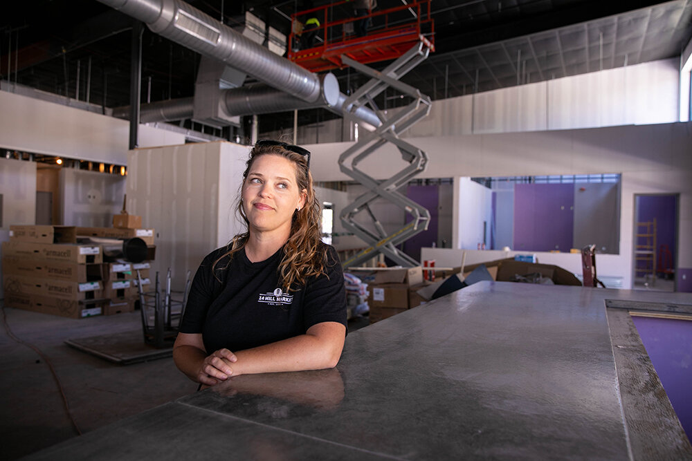 END IN SIGHT: Leah Callahan, co-owner of 14 Mill Market, says the newly installed 33-foot bar, along with a planned lineup of 10 food vendors, should be ready for customers next month.
