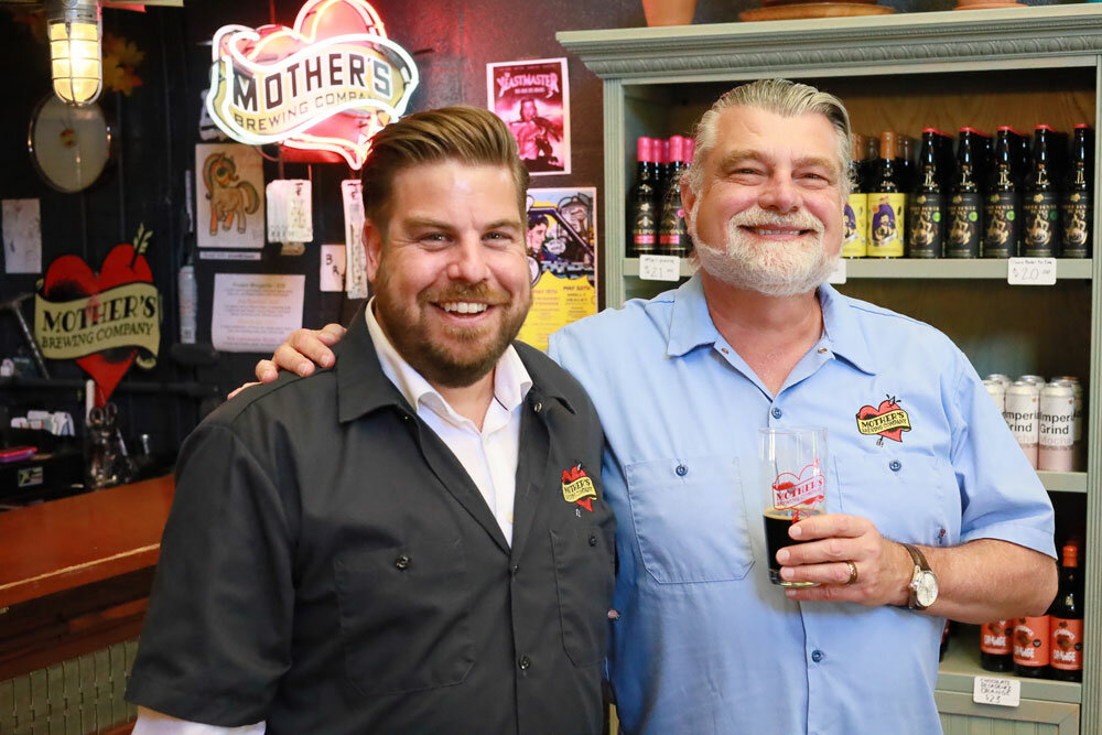 Mother's Brewing Co. founder Jeff Schrag, right, passes the ownership torch to Jeff Seifried.