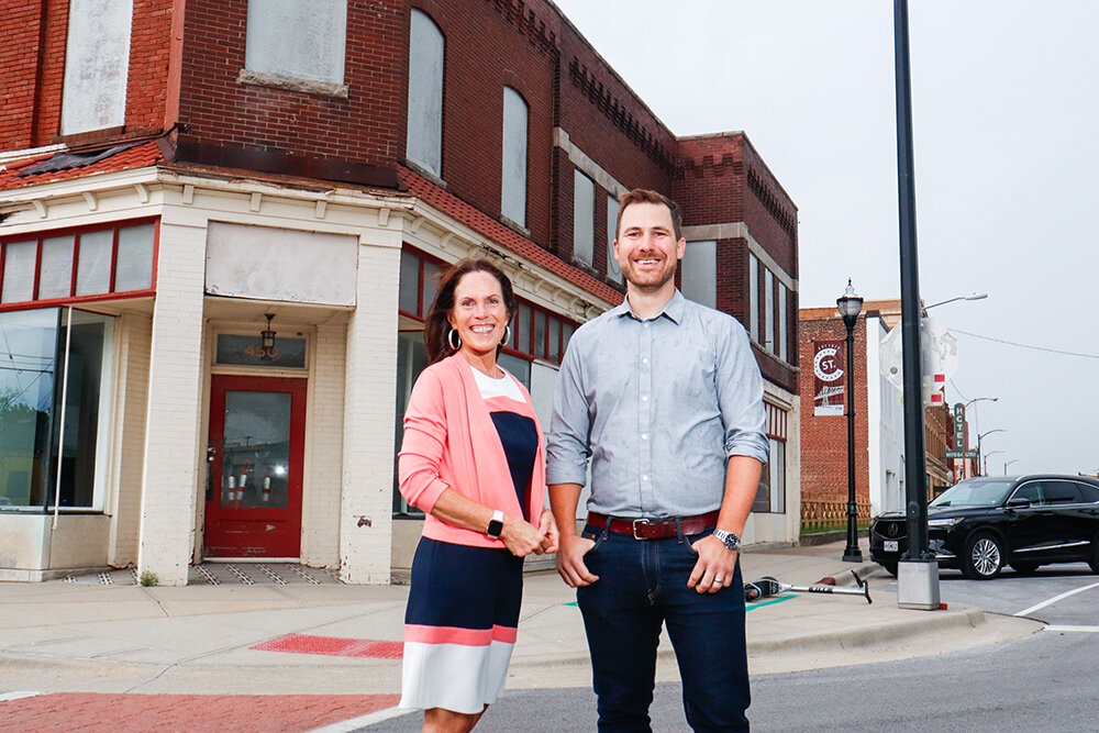 Nancy Caughlan Evans and Brandon Biskup are organizing a local chapter of the Urban Land Institute. They're standing on Commercial Street, where zoning codes are impacting redevelopment plans.