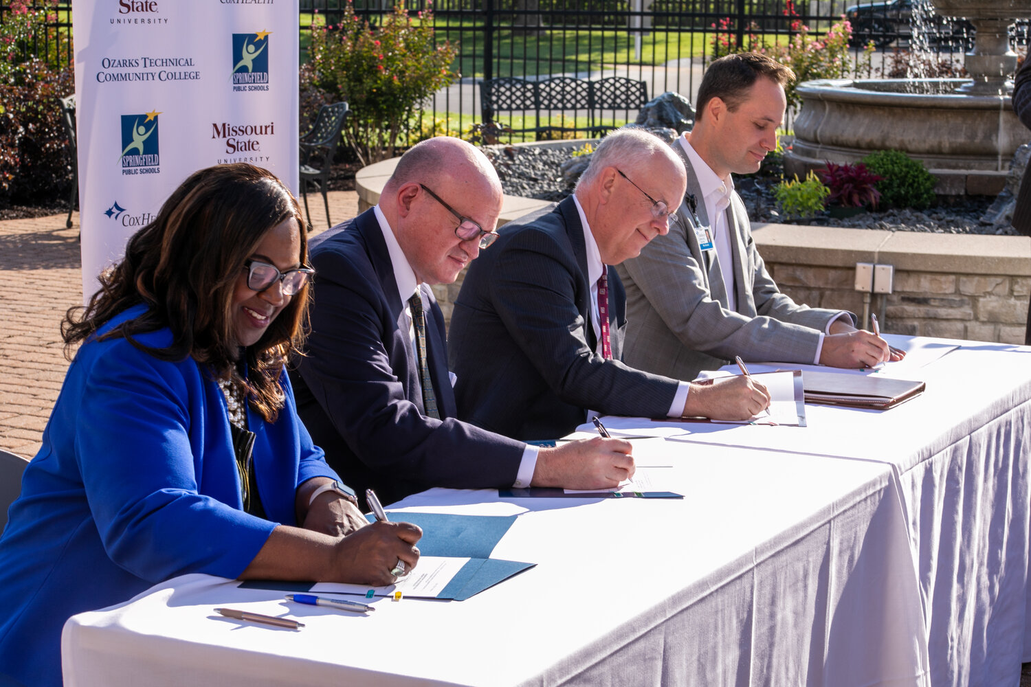 Signing an agreement to form the Alliance for Healthcare Education are, from left, Grenita Lathan, Springfield Public Schools; Hal Higdon, Ozarks Technical Community College; Clif Smart, Missouri State University; and Max Buetow, CoxHealth.