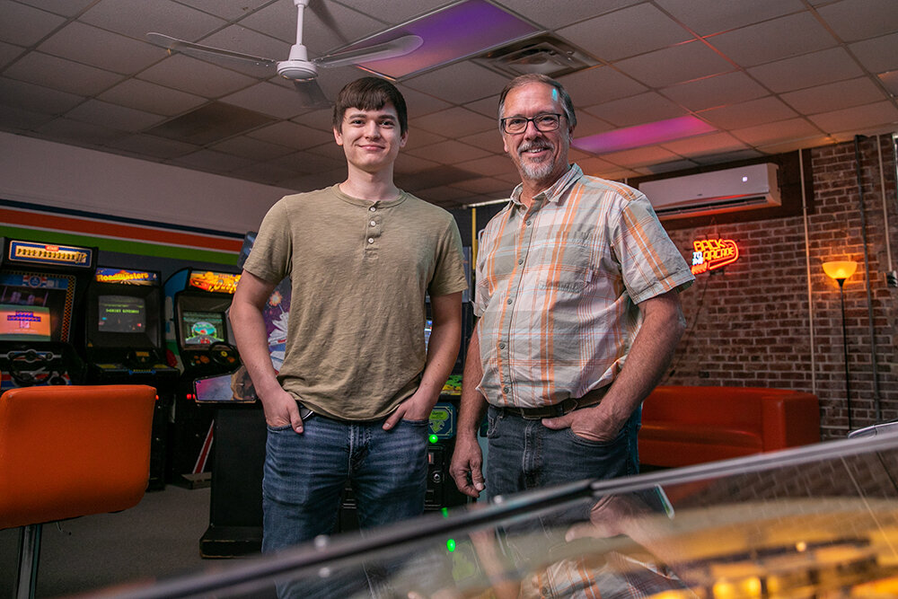 Lyndall Fraker, right, and his oldest son, Landon, are among owners of the family-run RetroZone Marshfield arcade, which relocated in August to the Marshfield Community Center. The Frakers also own the MCC, which they have been renovating for the past year.