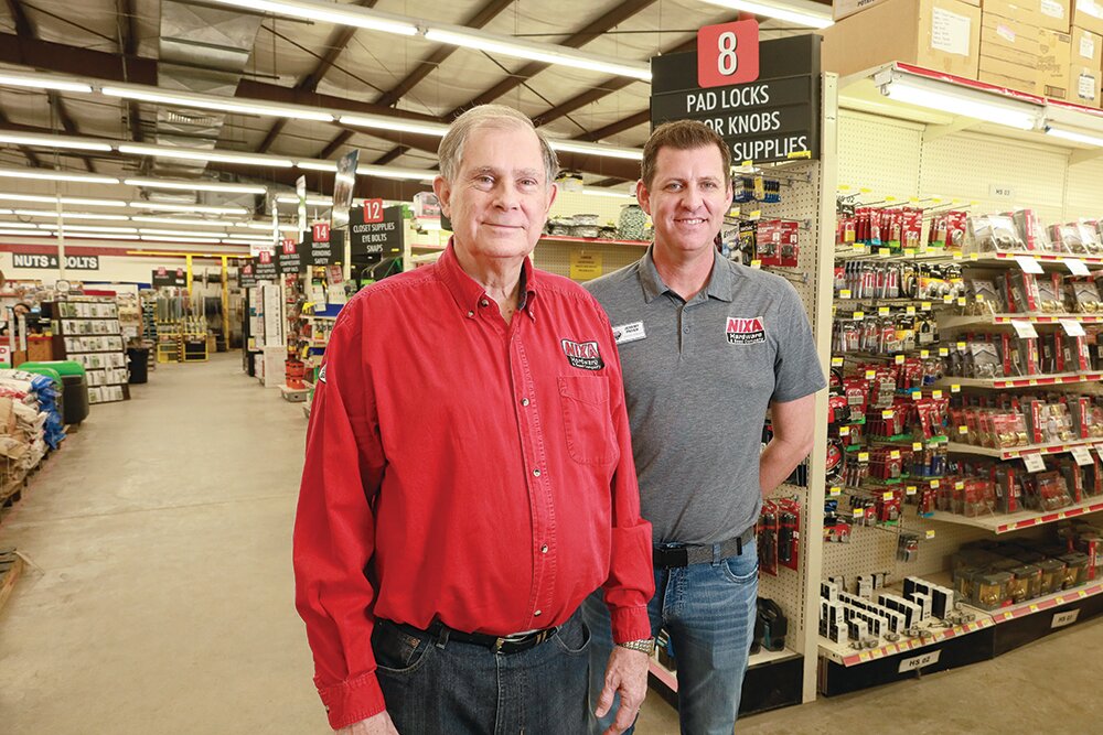 CELEBRATING 125 YEARS: Nixa Hardware & Seed Co. owner Larry McCroskey, left, and manager Jeremy Pryer plan to celebrate the company's anniversary throughout the year.